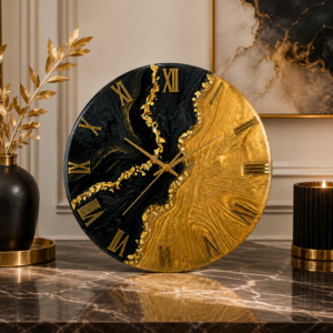 Elegant black and gold resin wall clock featuring a bold design and luxurious golden detailing.