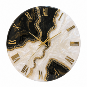 Elegant black and white resin wall clock with gold accents, Roman numerals, and artistic details.