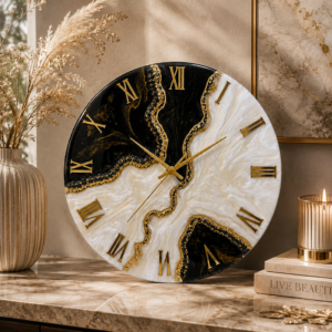 Black and white decorative art wall clock Luxury black and white resin wall clock featuring golden accents and a striking flowing design.