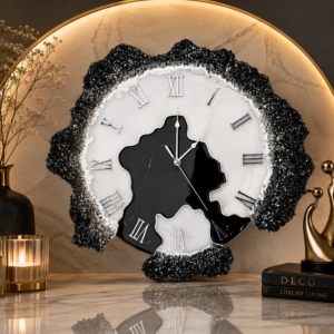 Obsidian black and white geode resin wall clock with gold veining, Roman numerals, and sparkling crystal edging.