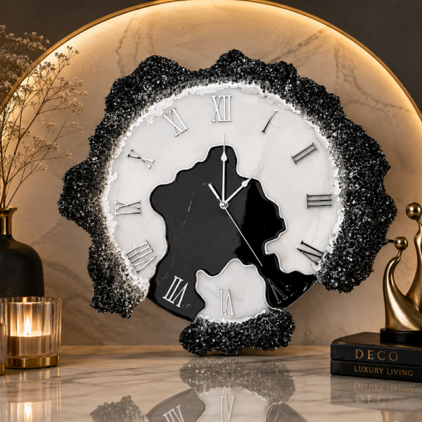 Obsidian black and white geode resin wall clock with gold veining, Roman numerals, and sparkling crystal edging.