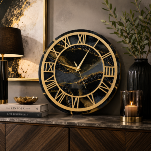 Luxury black resin wall clock with gold Roman numerals, patterns, and metallic detailing