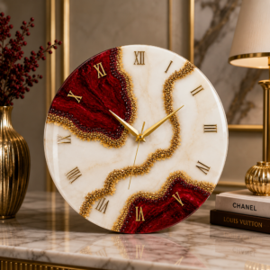 Red and cream luxury resin wall clock with gold Roman numerals, crystal details, and elegant design.