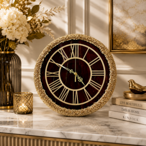 Burgundy resin wall clock with Roman numerals and ornate textured frame for elegant home decor.