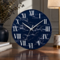 Navy blue minimalist luxury wall clock with white Roman numerals and marble-effect design.