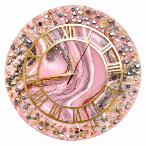 Elegant pink resin wall clock with crystal-textured border, gold Roman numerals, and artistic design.