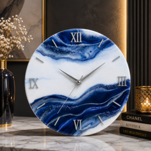 Luxury blue and white resin wall clock with silver Roman numerals, crafted for elegant home decor.